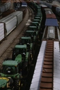 Freight trains from above, John Deere tractors on flat cars 